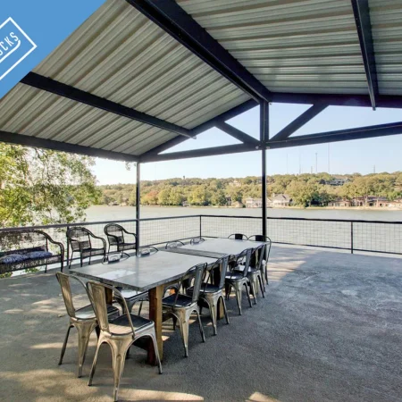 Covered lake deck with metal roof and outdoor seating built by expert dock builders in Austin, Texas