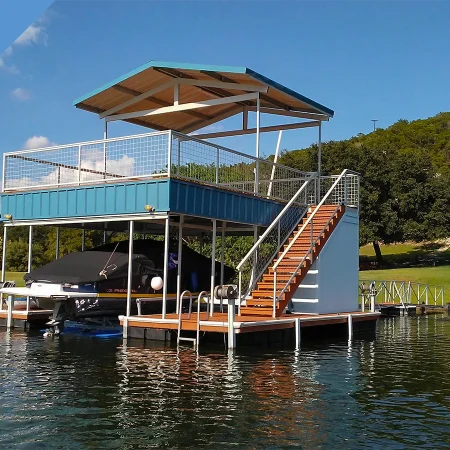 Two-story lake dock with boat lift and covered upper deck built by Longhorn Docks in Austin, Texas